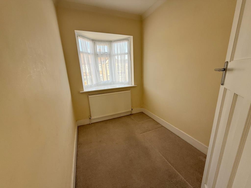 Lot: 59 - THREE-BEDROOM HOUSE FOR REPAIR AND IMPROVEMENT - Bedroom with window to front aspect